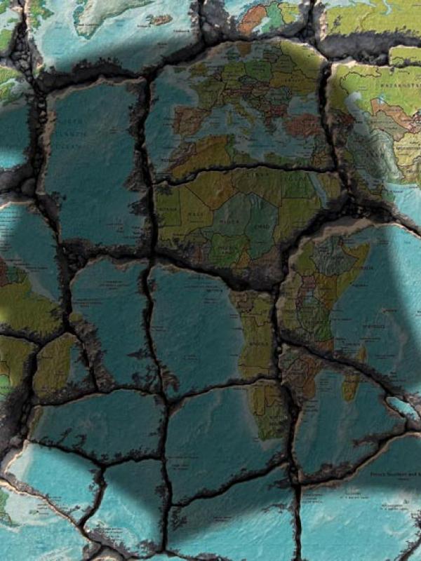 Symbolbild: Trumps Konterfei auf einer Weltkarte in Trümmern (IMAGO / Ralph Peters)